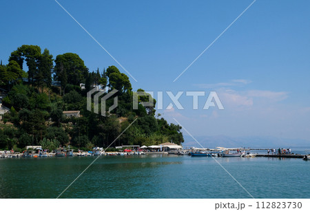 Monastery on the water, over which planes take off and land Greece Corfu island Vlacherna Monastery  112823730