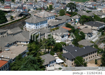 City of Gjirokaster in Southern Albania. Old Town is a UNESCO World Heritage Site. Closeup of Architectural Buildings. 112824161
