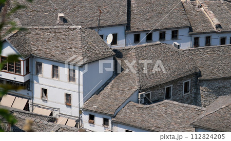 City of Gjirokaster in Southern Albania. Old Town is a UNESCO World Heritage Site. Closeup of Architectural Buildings. 112824205
