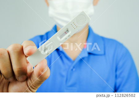 Man holding at Corona virus Antigen test kits (Covid 19) not infected with virus health and medicine concept Man holding at Corona virus Antigen test kits (Covid 19) not infected with virus health and medicine concept 112826502