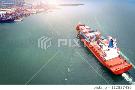 International trade concept .Aerial view of container shipping business Import-Export Logistics Shipping ships are heading to ports, transported by large cargo ships. International trade concept .Aerial view of container shipping business Import-Export Logistics Shipping ships are heading to ports, transported by large cargo ships. 112827456