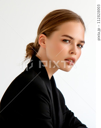Fashionable girl in black classic suit in studio 112828003