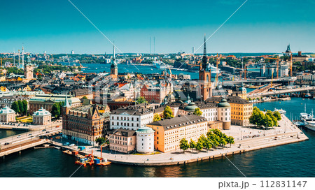 Stockholm, Sweden. Riddarholm Church, The Burial Place Of Swedish Monarchs On The Island Of Riddarholmen. Sunny Cityscape Skyline. Elevated View Of Gamla Stan Stockholm, Sweden. Riddarholm Church, The Burial Place Of Swedish Monarchs On The Island Of Riddarholmen. Sunny Cityscape Skyline. Elevated View Of Gamla Stan 112831147