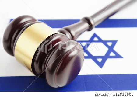 Israel, Legal, justice and agreement, wooden court gavel on flag. Israel, Legal, justice and agreement, wooden court gavel on flag. 112836606
