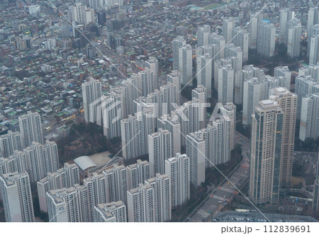 Aerial view of Seoul Downtown Skyline, South Korea. Financial district and business centers in smart urban city in Asia. Skyscraper and high-rise buildings. Aerial view of Seoul Downtown Skyline, South Korea. Financial district and business centers in smart urban city in Asia. Skyscraper and high-rise buildings. 112839691