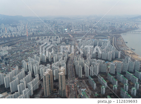 Aerial view of Seoul Downtown Skyline, South Korea. Financial district and business centers in smart urban city in Asia. Skyscraper and high-rise buildings. Aerial view of Seoul Downtown Skyline, South Korea. Financial district and business centers in smart urban city in Asia. Skyscraper and high-rise buildings. 112839693