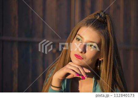 Portrait of a beautiful brunette girl with bright makeup. Portrait of a beautiful brunette girl with bright makeup. 112840173