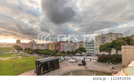 Panorama showing aerial view of Jardim da Alameda in Lisbon with the Luminous Fountain timelapse during sunset. Panorama showing aerial view of Jardim da Alameda in Lisbon with the Luminous Fountain timelapse during sunset. 112841830
