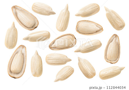 Big set of open sunflower seeds in half shells isolated on white background 112844034
