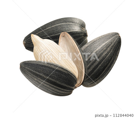 Sunflower seeds pile isolated on white background. Sunflower seeds pile isolated on white background. 112844040