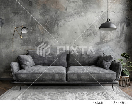 Grey sofa against concrete stucco wall. Industrial, loft home interior design 112844693