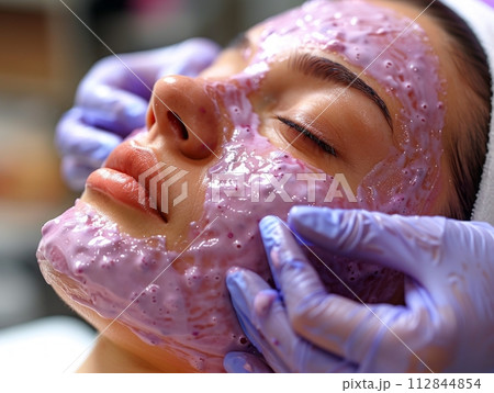 Close view of medical procedure making by faceless doctor for female patient in beauty clinic Close view of medical procedure making by faceless doctor for female patient in beauty clinic 112844854