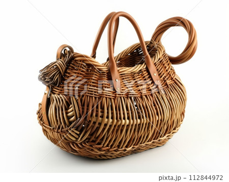 A basket bag that is made from natural materials on white, eco trend A basket bag that is made from natural materials on white, eco trend 112844972