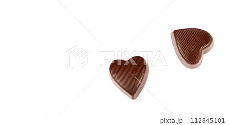 Chocolate candies isolated on white. Free space for text. Wide photo. 112845101