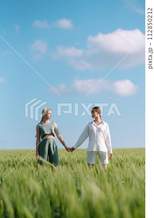 Two Beautiful woman in the green field. Nature, vacation, relax and lifestyle. Summer landscape. 112850212