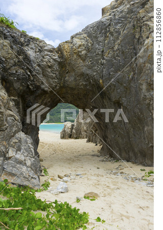 Natural stone arch of Aharen beach in Tokashiki Island, Okinawa, Japan. Natural stone arch of Aharen beach in Tokashiki Island, Okinawa, Japan. 112856860