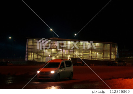 Windows glowing in the darkness of the night, showcasing a city urban landscape and architectural design. 112856869