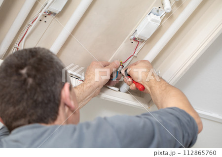 The profession of electrician is one of the most demanding and responsible professions of a construction worker. 112865760