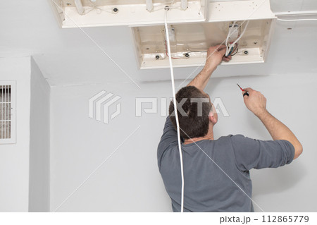 The profession of electrician is one of the most demanding and responsible professions of a construction worker. 112865779