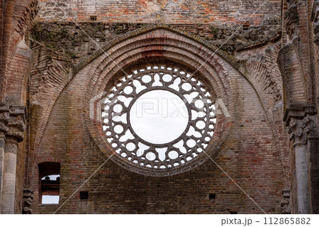 Destroyed window rosette at the abandoned Cistercian monastery San Galgano in the Tuscany Destroyed window rosette at the abandoned Cistercian monastery San Galgano in the Tuscany 112865882