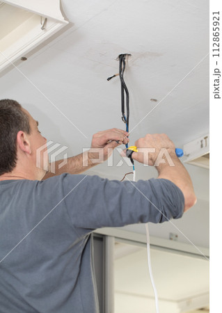 The profession of electrician is one of the most demanding and responsible professions of a construction worker. 112865921