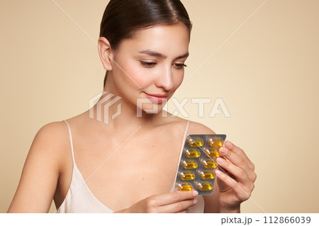 Beautiful Girl With Pill With Cod Liver Oil Omega-3 112866039