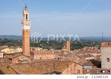 View over the roofs of Siena towards the Torre Magna, seen from the roof of the Siena cathedral View over the roofs of Siena towards the Torre Magna, seen from the roof of the Siena cathedral 112866320