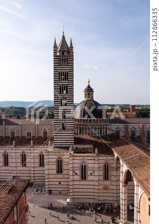 The Siena cathedral and its cupola, seen from the Facciatone panoramic viewpoint The Siena cathedral and its cupola, seen from the Facciatone panoramic viewpoint 112866335