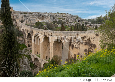 The famous aqueduct bridge from Roman times in Gravina, Italy The famous aqueduct bridge from Roman times in Gravina, Italy 112866498