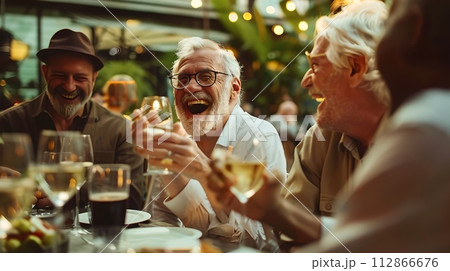 Joyful Senior Friends Laughing Together at a Dinner Party. Candid Moments Shared Over Meals. Happy Retirement Lifestyle Captured in Warm, Evening Light. AI 112866676
