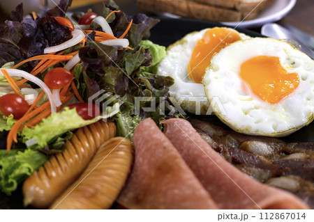Healthy Breakfast With Fresh Organic Vegetable Salad Fried Egg And Sausages. Fresh food. Healthy Breakfast With Fresh Organic Vegetable Salad Fried Egg And Sausages. Fresh food. 112867014