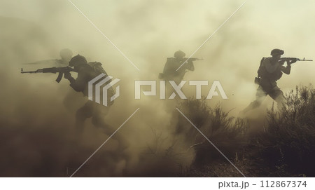 soldiers on the battlefield in modern war, no visible faces. dusty background 112867374