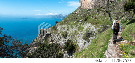 Hiking the famous path Sentiero degli Dei, the path of Gods at the Amalfi coast, Italy Hiking the famous path Sentiero degli Dei, the path of Gods at the Amalfi coast, Italy 112867572