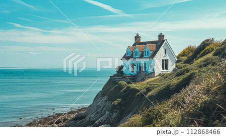 White coastal cottage in the English countryside style by the seaside 112868466