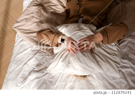 Person sleeping with smartwatch 112870141