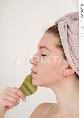 Facial skincare with natural stone Facial skincare with natural stone 112870276
