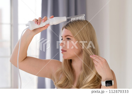 Enjoying microcurrent hair therapy. Enjoying microcurrent hair therapy. 112870333