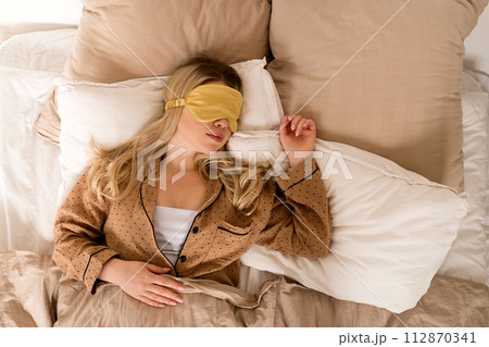 Woman sleeping with eye mask Woman sleeping with eye mask 112870341
