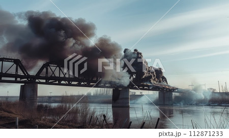 Powerful explosion on a concrete road bridge during the day. burning bridge. 112871233