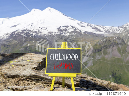 Childhood trauma symbol. Concept words Childhood trauma on beautiful black chalk blackboard. Chalkboard. Beautiful mountain Elbrus background. Business psychology childhood trauma concept. Copy space. Childhood trauma symbol. Concept words Childhood trauma on beautiful black chalk blackboard. Chalkboard. Beautiful mountain Elbrus background. Business psychology childhood trauma concept. Copy space. 112871440