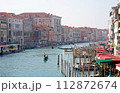 Italy. Venice. Grand Canal. Colorful city view with iron bridges, old buildings and architecture, boats and beautiful water reflections 112872674