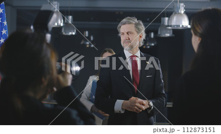 American politician comes to journalists after political speech American politician comes to journalists after political speech 112873151