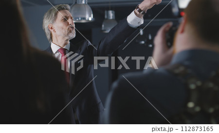 Politician comes on press conference with news journalists 112873165