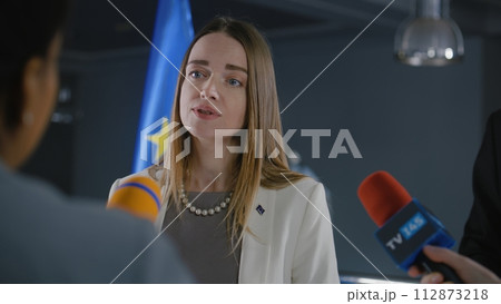 Female Representative of the European Union talks to news journalists Female Representative of the European Union talks to news journalists 112873218