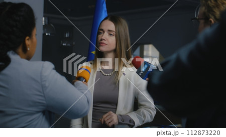 European female politician gives interview for media 112873220