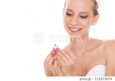 Happy bride woman admiring engagement ring. 112873674
