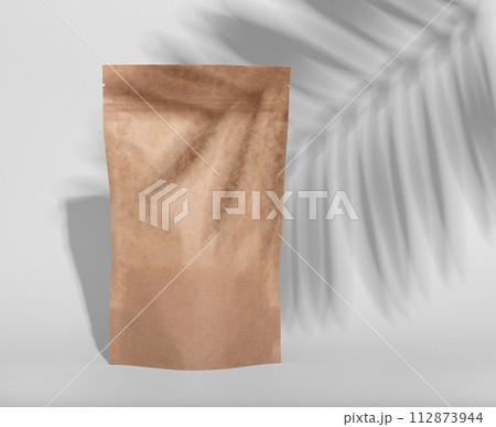 Zip-lock pack, kraft paper bag mockup. Brown tea pouch, product package 112873944