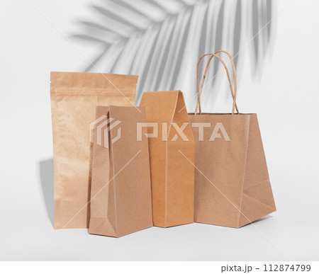 Craft paper bag, box. Brown beige eco packages, packs for product, gifts Craft paper bag, box. Brown beige eco packages, packs for product, gifts 112874799