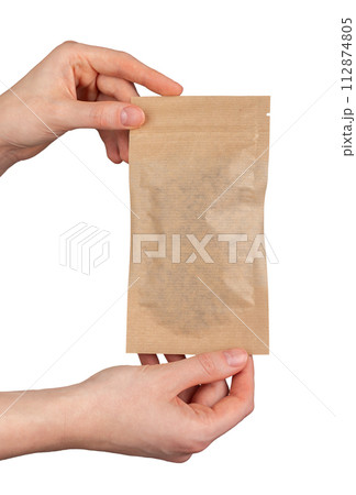 A person is holding a brown paper bag A person is holding a brown paper bag 112874805