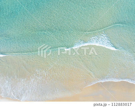 Amazing nature seashore landscape background,Aerial view waves crashing on beach ocean background Amazing nature seashore landscape background,Aerial view waves crashing on beach ocean background 112883017